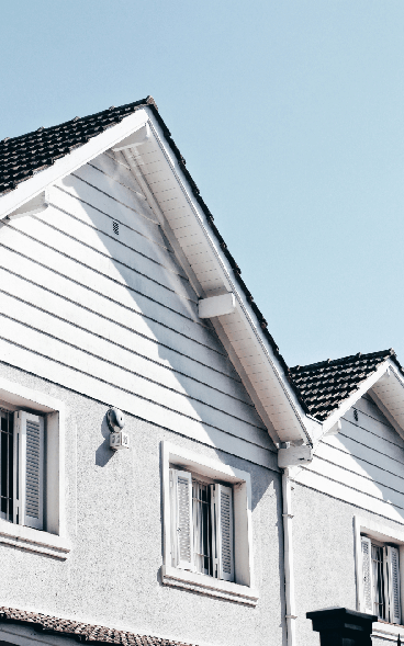 A view of a nicely repaA view of a nicely repaired roof with a gutter by ORMA Gutter Solutions